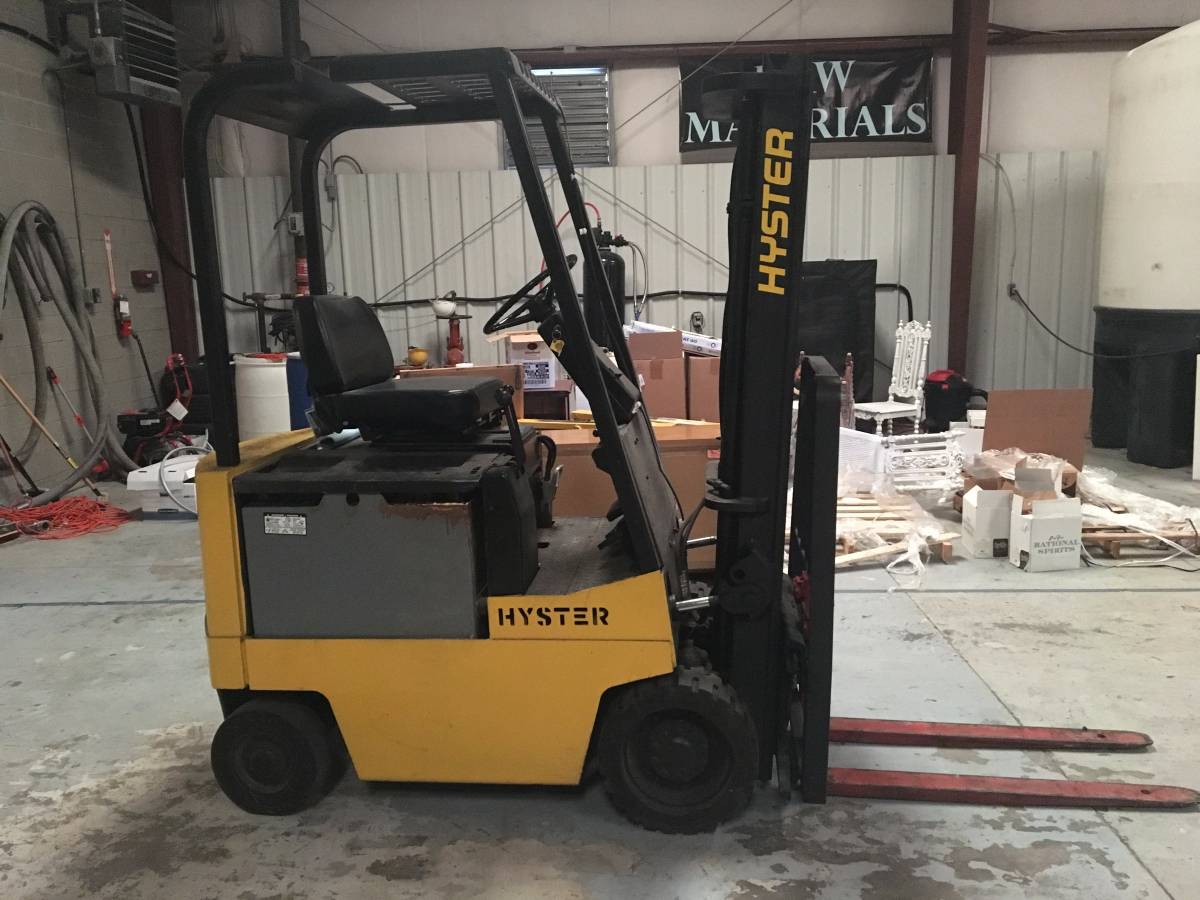 Yellow counterbalance forklift with cushion tires
