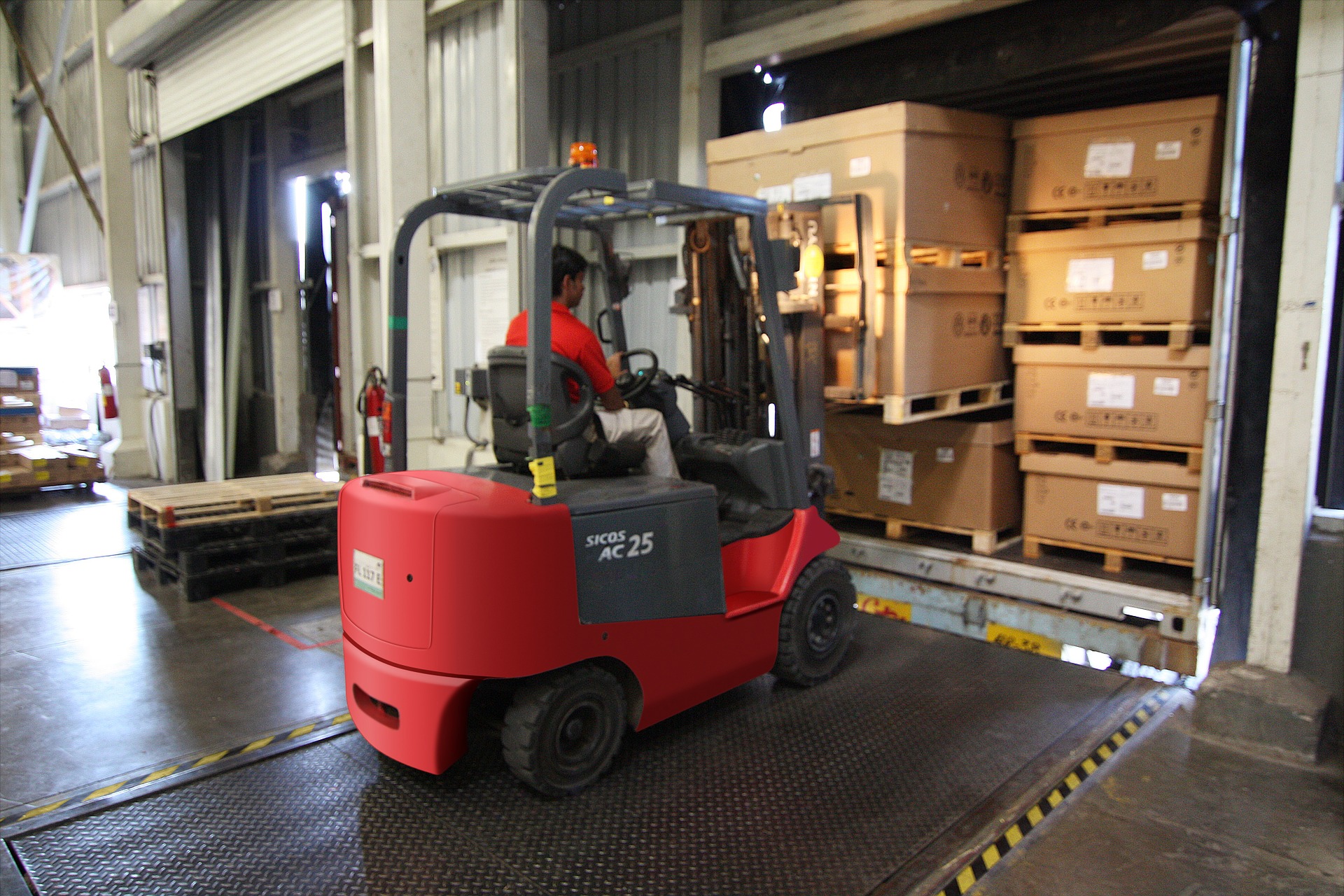 Operator undergoing forklift training in a warehouse