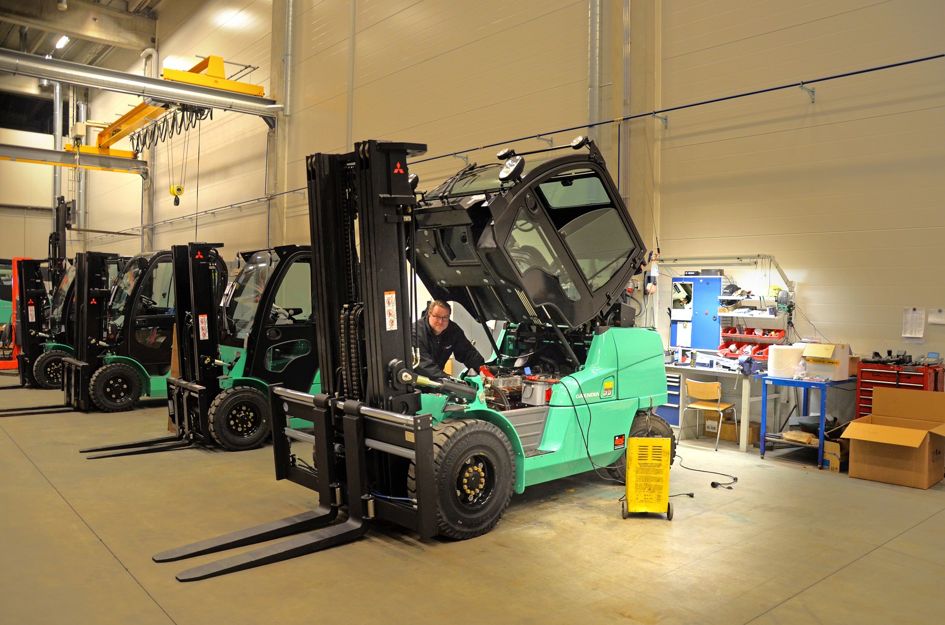 New forklifts for sale parked in a warehouse